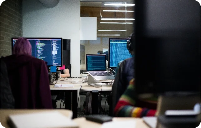 person sitting on chair and writing web development code